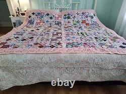 Beautiful, classic four patch quilt, made from pastel colores solid pink68 X 80