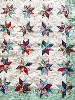 Hand-stitched antique/vintage feedsack quilt