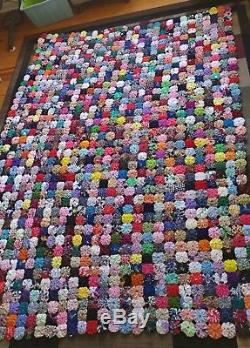 Handmade vintage large YoYo quilt approximately 102 by 74