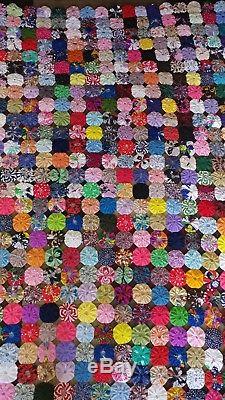 Handmade vintage large YoYo quilt approximately 102 by 74