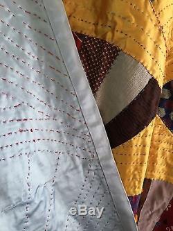 Very large vintage folk art, hand made necktie fan quilt. Excellent condition. Wow