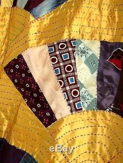 Very large vintage folk art, hand made necktie fan quilt. Excellent condition. Wow