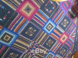 Vintage/Antique Handmade Quilt with a dark background great quilt for any room