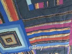 Vintage/Antique Handmade Quilt with a dark background great quilt for any room