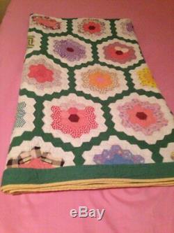 Vintage handmade Grandmother's Garden quilt