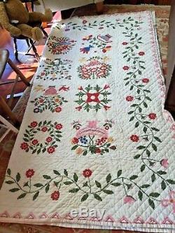 Vintage handmade quilt done in cross-stitch wonderful bright color