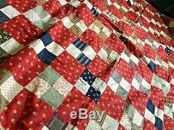 Vintage handmade quilt wonderful colors in red blues and browns